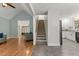 Open-concept layout with seamless transition from living room, to stairs, to kitchen at 5541 Old Still Rd, Wake Forest, NC 27587