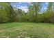 Large backyard offering ample space for outdoor activities and potential landscaping projects at 56 Marlless Dr # A & B, Franklinton, NC 27525