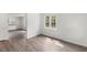 Sunlit bedroom with hardwood floors and a view of the outdoors from the window at 56 Marlless Dr # A & B, Franklinton, NC 27525