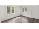 Bedroom features hardwood floors, bright natural light and a large window at 56 Marlless Dr # A & B, Franklinton, NC 27525