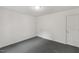 This is a bedroom with neutral paint, carpet, and a bright ceiling light at 56 Marlless Dr # A & B, Franklinton, NC 27525