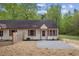 A well-maintained single-story home with red shutters, wood accents, and a gravel front yard at 56 Marlless Dr # A & B, Franklinton, NC 27525