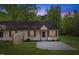 A cozy single-story home with wood siding, red shutters, and a well-maintained front yard at 56 Marlless Dr # A & B, Franklinton, NC 27525