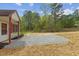 Side angle view of a light colored house with gravel and natural landscaping at 56 Marlless Dr # A & B, Franklinton, NC 27525