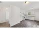 Well lit Kitchen with white cabinets, appliances, and wood grain flooring at 56 Marlless Dr # A & B, Franklinton, NC 27525