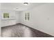 Bright, fully equipped kitchen featuring white cabinets and wood grain flooring at 56 Marlless Dr # A & B, Franklinton, NC 27525