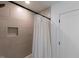 Modern bathroom showcasing tiled shower with niche and a white shower curtain at 612 E Ellerbee St, Durham, NC 27704