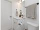Contemporary bathroom with white vanity, black fixtures, and neutral gray towels at 612 E Ellerbee St, Durham, NC 27704