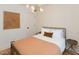 Stylish bedroom with a gold bed frame, side table, and a neutral-toned quilt and decor at 612 E Ellerbee St, Durham, NC 27704