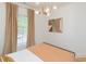 Bright bedroom with view from the window, modern lighting, and stylish wall art at 612 E Ellerbee St, Durham, NC 27704