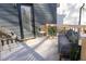 View of a furnished outdoor deck featuring comfortable seating and access to the home's entry at 612 E Ellerbee St, Durham, NC 27704