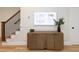 Stylish entryway featuring modern art, a sleek console table, and hardwood flooring leading to the stairs at 612 E Ellerbee St, Durham, NC 27704