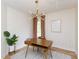 Home office featuring mid-century modern desk, stylish light fixture, and neutral walls at 612 E Ellerbee St, Durham, NC 27704