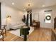 Bright living room featuring hardwood floors, modern lighting, and stylish furniture with window views at 612 E Ellerbee St, Durham, NC 27704