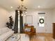Bright living room featuring a white door, modern lighting, hardwood flooring, and stylish decor at 612 E Ellerbee St, Durham, NC 27704