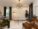 Bright living room featuring hardwood floors, modern lighting fixture, and comfortable contemporary furnishings at 612 E Ellerbee St, Durham, NC 27704