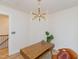 Bright office space featuring wood desk, modern lighting, and a decorative plant at 612 E Ellerbee St, Durham, NC 27704