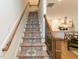 Carpeted stairway leading to the upper level, offering a blend of style and comfort at 612 E Ellerbee St, Durham, NC 27704