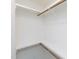 Empty walk-in closet with white walls, wood shelving, and electrical outlets visible at 612 E Ellerbee St, Durham, NC 27704
