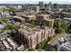 High angle view of building with manicured grounds in a vibrant city, surrounded by lush green trees and other buildings at 618 N Boylan Ave # 304, Raleigh, NC 27603