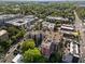 Aerial shot of the building showcasing rooftop amenities, with a pool, lush greenery, and city surroundings at 618 N Boylan Ave # 304, Raleigh, NC 27603