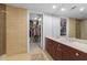 Bathroom featuring double vanity and walk-in closet, offering luxury and ample storage at 618 N Boylan Ave # 304, Raleigh, NC 27603