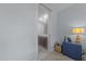 Bedroom area featuring closet behind a frosted door and classic nightstand with lamp at 618 N Boylan Ave # 304, Raleigh, NC 27603