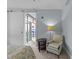 Cozy bedroom area showcasing chair seating and a sliding door to a sunroom at 618 N Boylan Ave # 304, Raleigh, NC 27603
