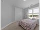 Comfortable bedroom with double closet doors and natural light from the window at 618 N Boylan Ave # 304, Raleigh, NC 27603