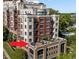 Luxurious condo rooftop terrace with modern furniture, plants, and pergola, perfect for entertaining at 618 N Boylan Ave # 304, Raleigh, NC 27603