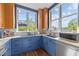 Well-lit blue kitchen with modern appliances and ample counter space at 618 N Boylan Ave # 304, Raleigh, NC 27603
