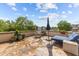 Spacious rooftop patio with stone flooring, lounge chair and dining table, ideal for entertaining guests at 618 N Boylan Ave # 304, Raleigh, NC 27603
