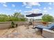 Spacious patio area with elegant stone flooring and stylish lounge seating under a sunshade at 618 N Boylan Ave # 304, Raleigh, NC 27603