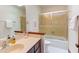 Bathroom featuring a glass shower door, a modern sink, and tiled floors at 635 Kensington Dr, Chapel Hill, NC 27514