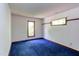 Bedroom featuring a carpeted floor, closet space, and natural light from two windows at 635 Kensington Dr, Chapel Hill, NC 27514