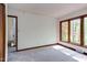 Bright bedroom featuring large windows and neutral carpeting allowing natural light at 635 Kensington Dr, Chapel Hill, NC 27514