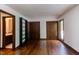 Hardwood floor bedroom with ensuite bathroom, closet space, and natural light at 635 Kensington Dr, Chapel Hill, NC 27514