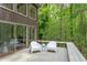 View of deck overlooking lush backyard with seating area at 635 Kensington Dr, Chapel Hill, NC 27514