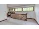 Hallway featuring a built-in desk and natural light from surrounding windows creating a bright work area at 635 Kensington Dr, Chapel Hill, NC 27514