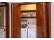 Laundry room with washer and dryer hidden behind wood folding doors for a neat and organized space at 635 Kensington Dr, Chapel Hill, NC 27514