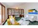 Cozy living room with large windows, built-in bookcase, and comfortable modern decor at 635 Kensington Dr, Chapel Hill, NC 27514