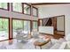Spacious living room with large windows offering natural light, complemented by comfortable seating at 635 Kensington Dr, Chapel Hill, NC 27514