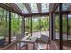 Bright sunroom with skylights, views of the yard, and an inviting dining area at 635 Kensington Dr, Chapel Hill, NC 27514
