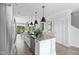 Open kitchen featuring an island with sink and bar seating, plus stainless appliances at 668 Bandon Aly, Cary, NC 27513