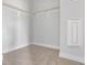 Walk-in closet with carpet flooring, offering ample storage space and a minimalist design for organization at 670 Bandon Aly, Cary, NC 27513