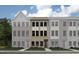 New townhouse complex with brick, gray and white facade, visible windows and front lawn at 670 Bandon Aly, Cary, NC 27513