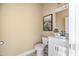 Powder room featuring neutral walls, a floating vanity, and modern fixtures at 679 Bandon Aly, Cary, NC 27513