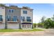 New townhome exterior featuring a two-car garage and upper-level balconies at 679 Bandon Aly, Cary, NC 27513
