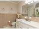 Bathroom features a neutral color scheme, vanity, and tile backsplash at 6813 W Lake Anne Dr, Raleigh, NC 27612