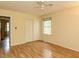 Bedroom boasts laminate floors, closet, ceiling fan, and a bright window at 6813 W Lake Anne Dr, Raleigh, NC 27612